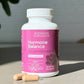Supplement bottle labeled 'Hormone Balance' by Sisterhood Supplements on a neutral background